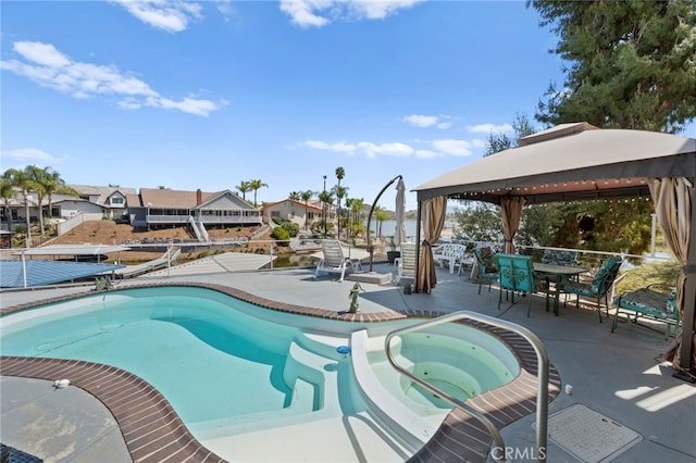 30594 Longhorn Dr, Canyon Lake, CA 92587 - view of swimming pool featuring a gazebo, a patio area, outdoor dining space, a pool with connected hot tub, and a residential view