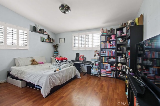 bedroom featuring wood finished floors