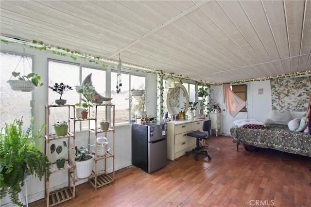 sunroom / solarium with wooden ceiling and hardwood / wood-style floors