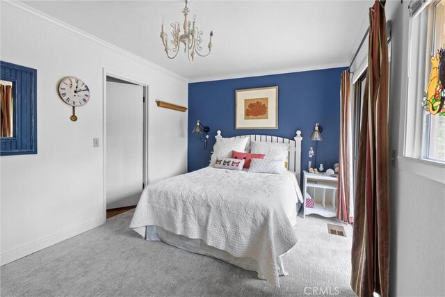 bedroom featuring a notable chandelier, crown molding, visible vents, carpet, and baseboards