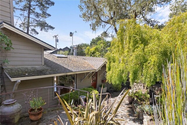 view of home's exterior featuring a shingled roof