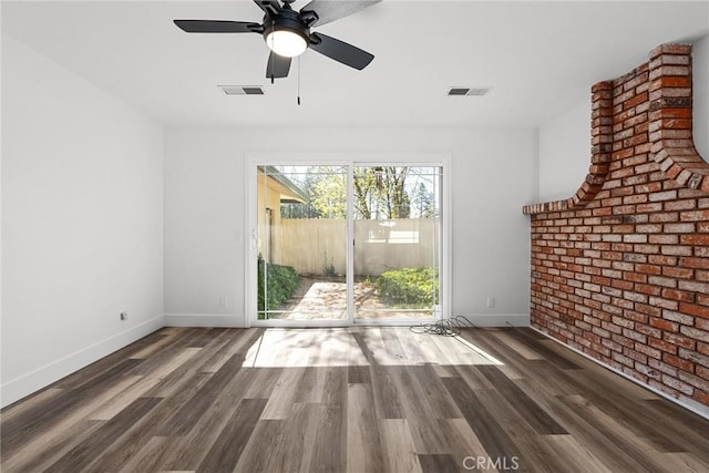 unfurnished living room featuring baseboards, a ceiling fan, wood finished floors, and visible vents