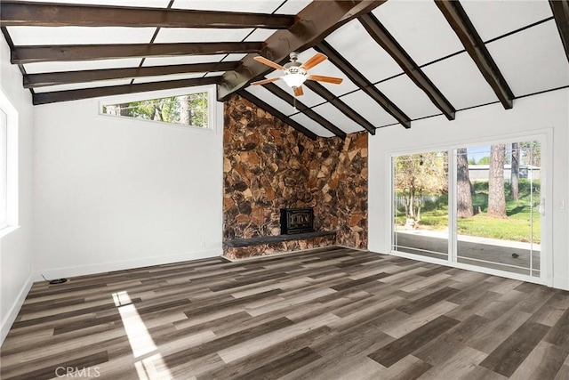 unfurnished living room with lofted ceiling with beams, baseboards, a ceiling fan, and wood finished floors