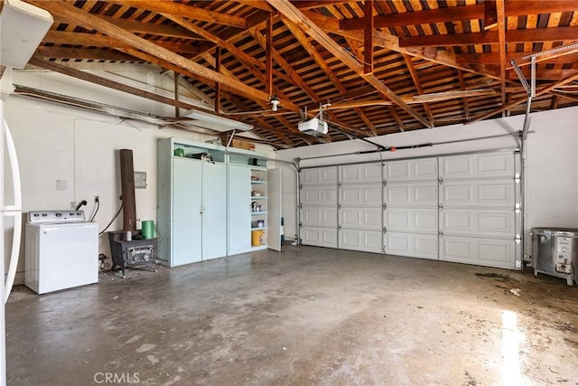 garage with washer / dryer and a garage door opener
