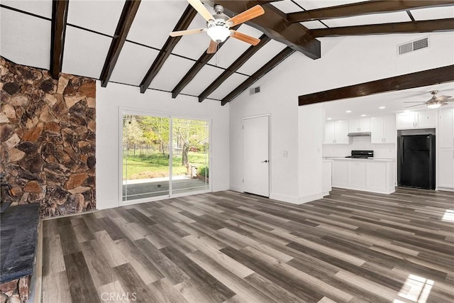 unfurnished living room with beamed ceiling, a ceiling fan, visible vents, and wood finished floors