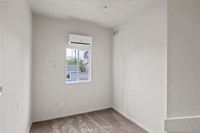 carpeted empty room with visible vents, an AC wall unit, and baseboards