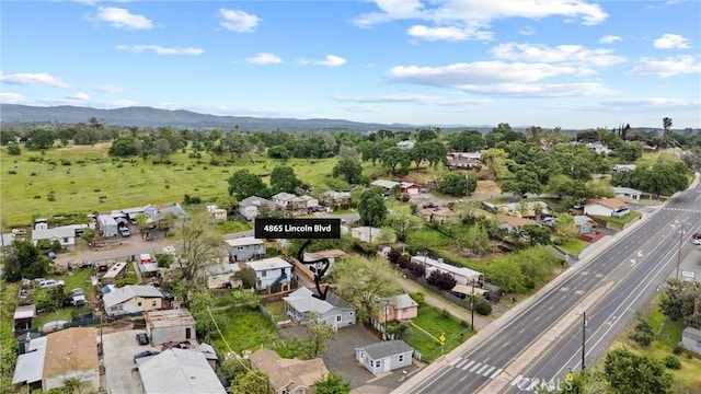 aerial view featuring a residential view and a mountain view