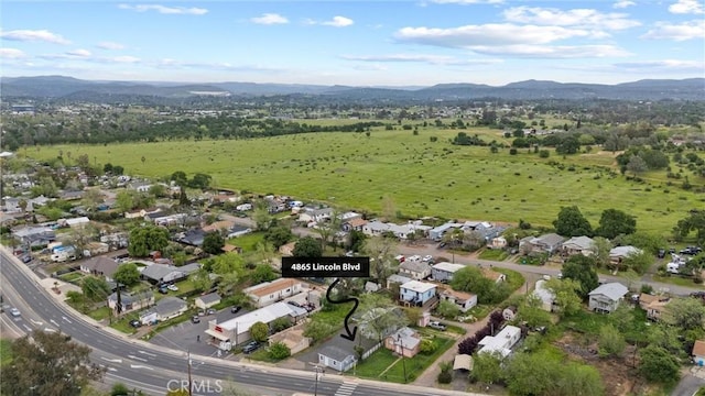 aerial view featuring a mountain view and a residential view