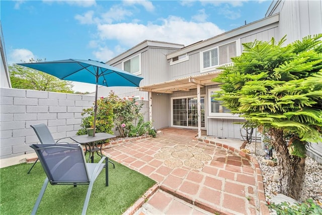 view of patio / terrace featuring fence