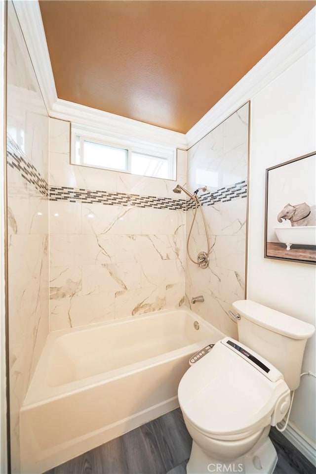 bathroom featuring bathing tub / shower combination, toilet, and wood finished floors