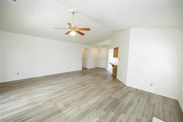 unfurnished living room with light wood-style flooring, baseboards, a ceiling fan, and lofted ceiling
