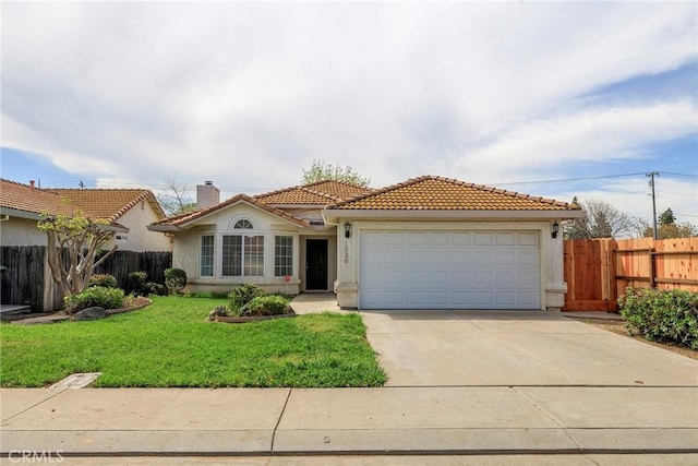 mediterranean / spanish-style home featuring concrete driveway, a front yard, a tile roof, a garage, and fence