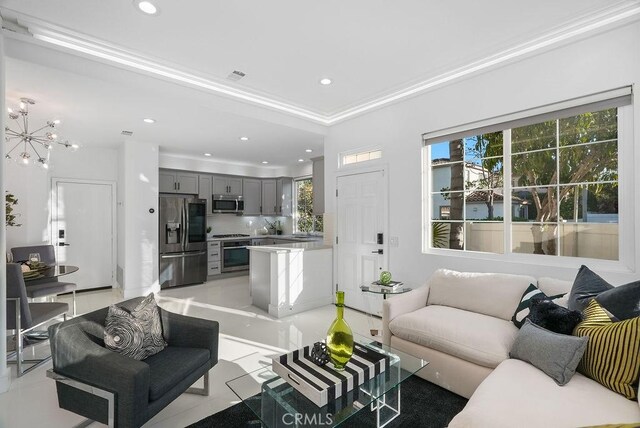 living area with recessed lighting, a chandelier, and light tile patterned flooring