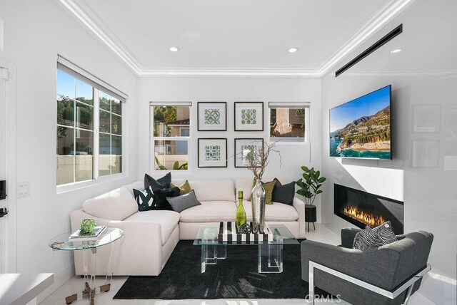 199 Las Flores, Aliso Viejo, CA 92656 - living area with a glass covered fireplace, ornamental molding, and recessed lighting