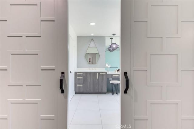 bathroom with vanity, tile patterned flooring, and recessed lighting
