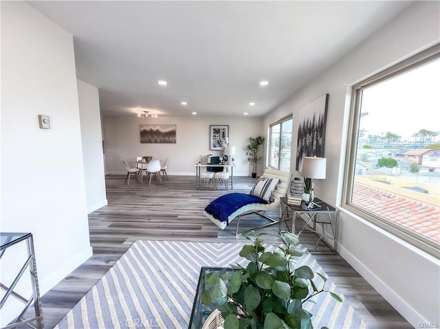 living room with recessed lighting, wood finished floors, and baseboards