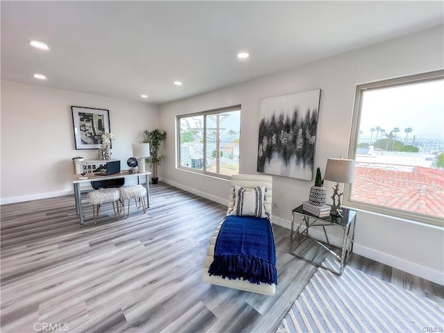 office with recessed lighting, wood finished floors, and baseboards