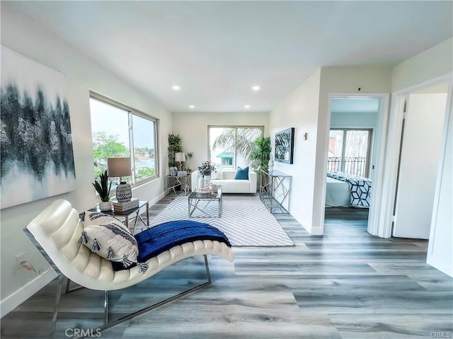 living room with recessed lighting, wood finished floors, and baseboards