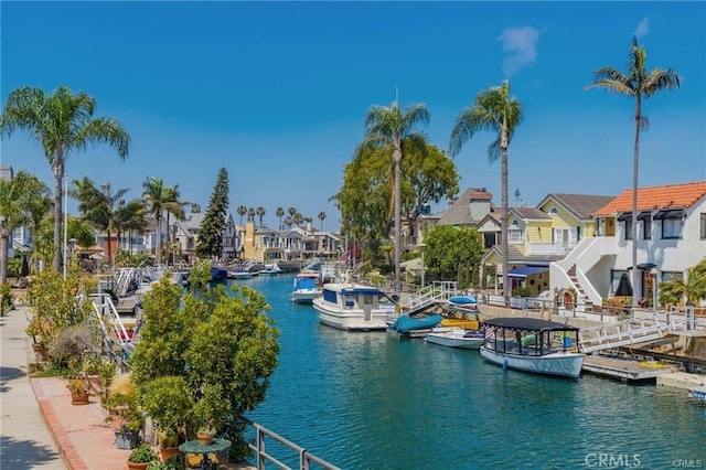 property view of water with a residential view and a floating dock