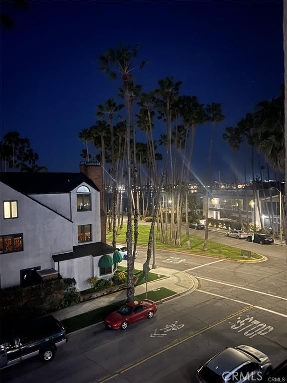 view of road with curbs and sidewalks
