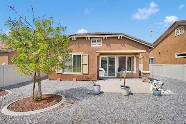 19547 Valley Ct, Apple Valley, CA 92308 - rear view of house with a fenced backyard, a patio, and stucco siding