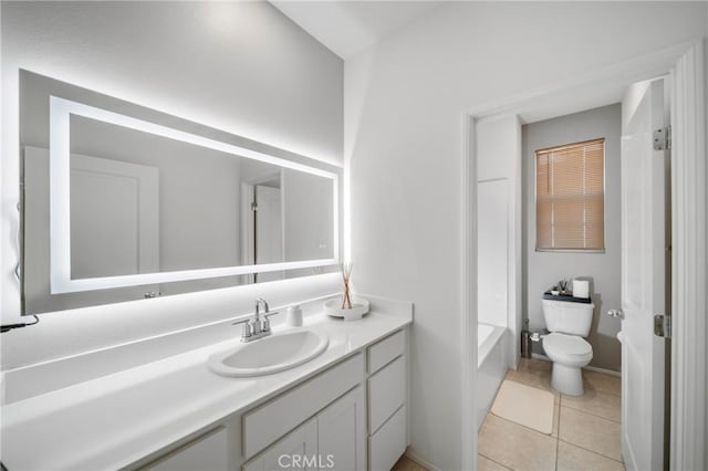 5313 Mariner Ln, Chino, CA 91710 - bathroom with baseboards, toilet, vanity, tile patterned floors, and a washtub