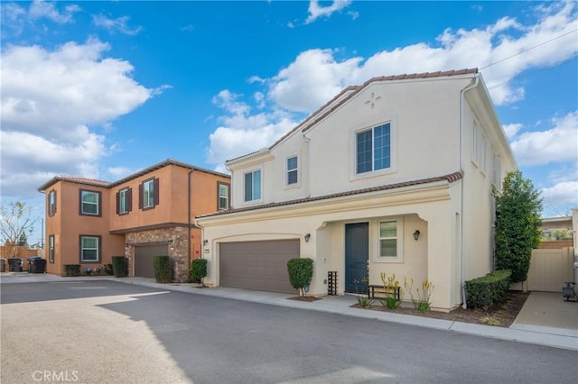 5313 Mariner Ln, Chino, CA 91710 - view of property with stucco siding, an attached garage, and a tile roof