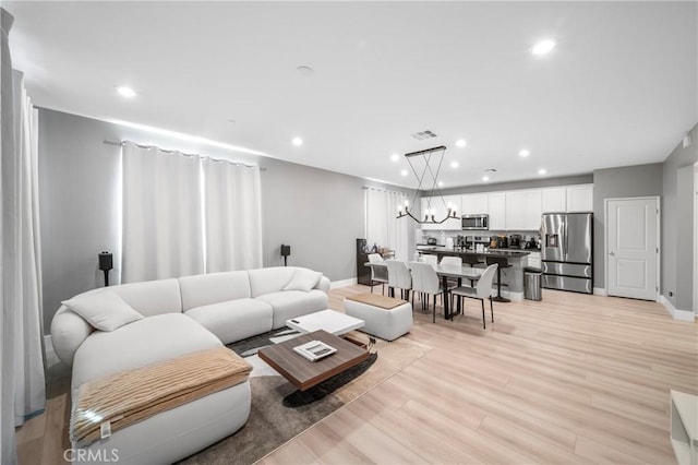 5313 Mariner Ln, Chino, CA 91710 - living area featuring a chandelier, light wood finished floors, baseboards, and recessed lighting