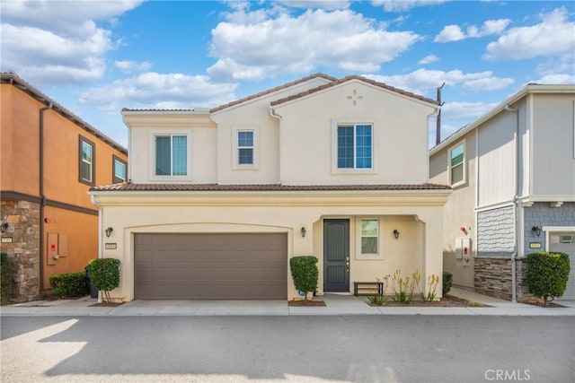 5313 Mariner Ln, Chino, CA 91710 - view of front of property featuring driveway, stucco siding, a tiled roof, and an attached garage