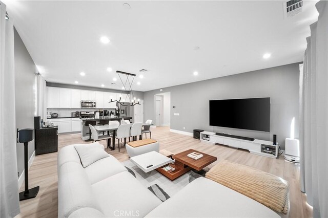 5313 Mariner Ln, Chino, CA 91710 - living area featuring recessed lighting, light wood-style flooring, baseboards, and visible vents