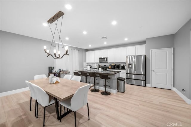 5313 Mariner Ln, Chino, CA 91710 - dining room with visible vents, baseboards, an inviting chandelier, recessed lighting, and light wood-style flooring