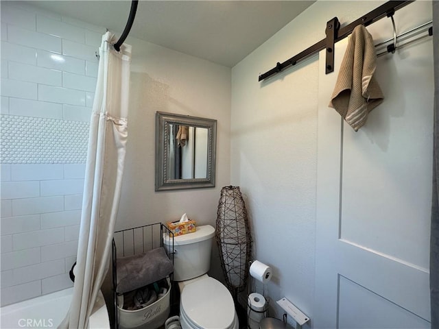 full bathroom with toilet and shower / bath combo with shower curtain