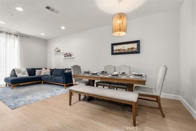 dining room featuring baseboards, recessed lighting, visible vents, and light wood-type flooring