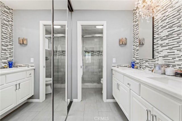 full bathroom featuring a stall shower, tasteful backsplash, and toilet