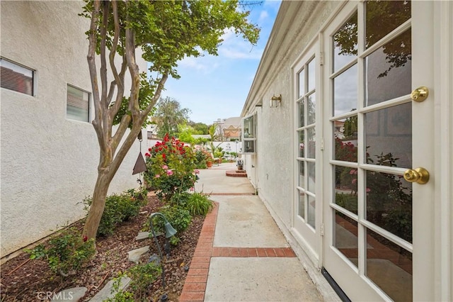view of property exterior with a patio, a fenced backyard, and stucco siding