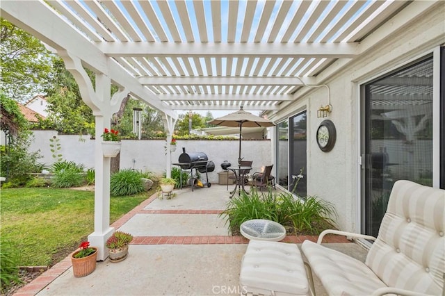 view of patio with grilling area, fence, and a pergola
