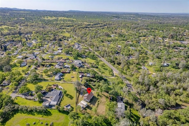 drone / aerial view featuring a view of trees