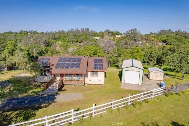 drone / aerial view featuring a view of trees