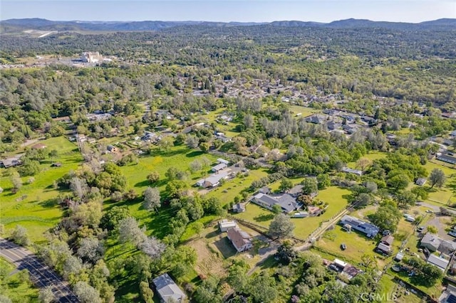 birds eye view of property featuring a mountain view