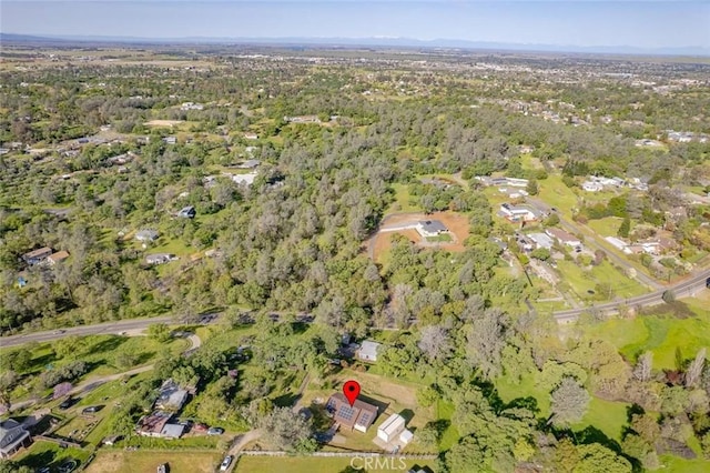 bird's eye view featuring a wooded view