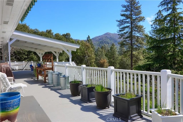 view of patio / terrace with a mountain view and outdoor dining area