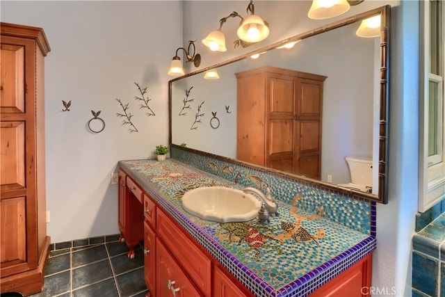 bathroom with tile patterned floors and vanity