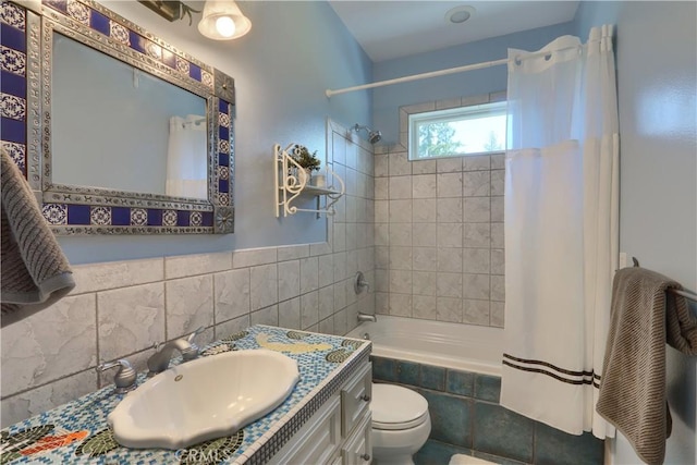 full bath with toilet, tiled shower / bath, and vanity