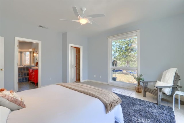 bedroom with tile patterned floors, visible vents, baseboards, and ceiling fan