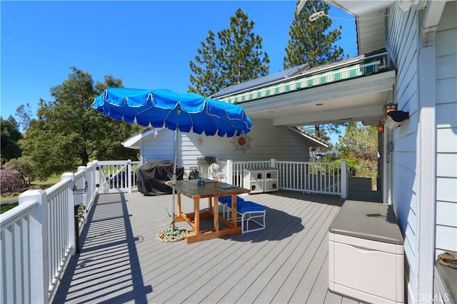 wooden deck with area for grilling