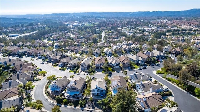 drone / aerial view featuring a mountain view and a residential view