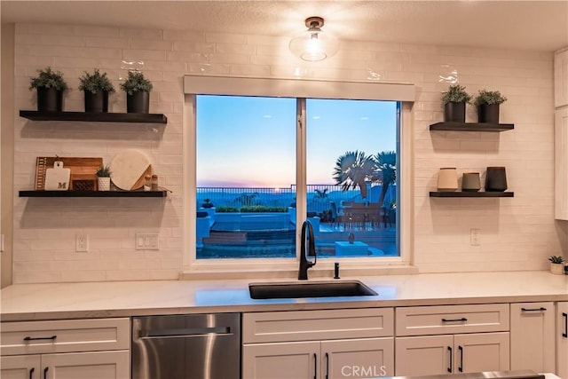 bar with tasteful backsplash and a sink