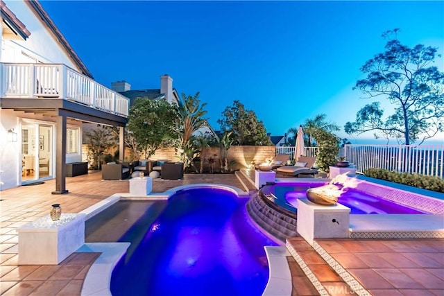 view of swimming pool with an outdoor hot tub, a fenced backyard, a patio, an outdoor hangout area, and a fenced in pool