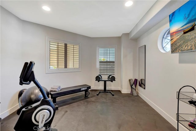 workout room featuring baseboards and recessed lighting