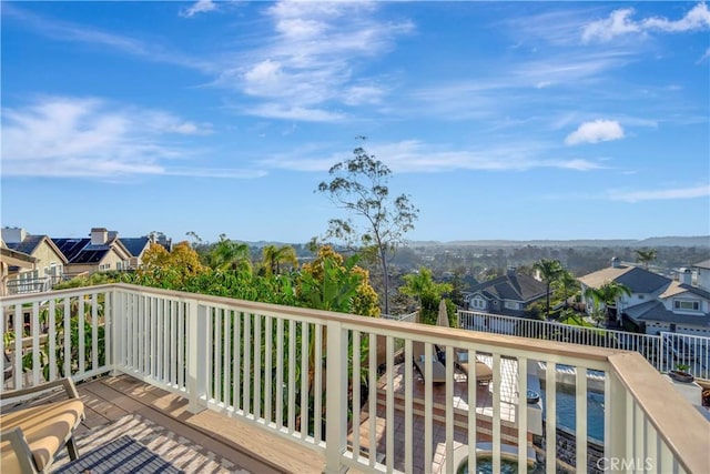 wooden deck with a residential view